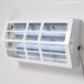 A white rectangular Curtron Pest-Pro UV flying insect light on a white wall.