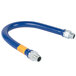 A blue flexible Dormont gas hose with a yellow label.