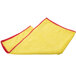 A yellow and red Unger SmartColor microfiber cloth with a red edge.