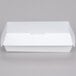 A 7" x 3" x 2 5/8" white paper sandwich clamshell container with a lid.
