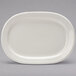 A white rectangular Tuxton china platter with an embossed rim.
