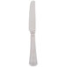 A silver Libbey stainless steel dinner knife with a white handle on a white background.