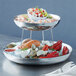 An American Metalcraft stainless steel double wall seafood tray with seafood on it.