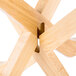 A Tablecraft bamboo fold-away riser set on a wooden table.
