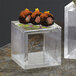 Sushi on American Metalcraft clear square acrylic risers.