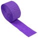 A long roll of Creative Converting amethyst purple paper streamer.