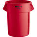 A red plastic Rubbermaid BRUTE trash can with handles.