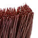 A close-up of a Carlisle 24" push broom head with maroon unflagged bristles.