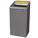 A grey rectangular Rubbermaid recycling container with a yellow lid.