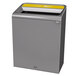 A grey rectangular Rubbermaid recycling container with a yellow lid.