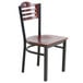 A Lancaster Table & Seating black metal bistro chair with a mahogany wood seat.