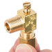 A gold plated brass regulating valve with a screw.