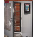 A Blodgett pass-through electric combi oven with a door open containing a rack of food.