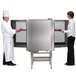 Two chefs using a Blodgett pass-through combi oven with touchscreen controls.
