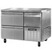 A Continental Refrigerator stainless steel undercounter freezer with two drawers and a half door.