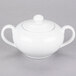 A white porcelain sugar bowl with a lid and two handles.