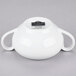 A white porcelain sugar bowl with two handles.