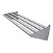 An Advance Tabco stainless steel tubular wall mounted drainage shelf with four metal bars.