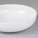 A close-up of a 10 Strawberry Street Classic White oval porcelain pasta bowl with a small rim.