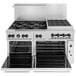 A large stainless steel Wolf commercial gas range with 6 burners, a charbroiler, and a convection oven.
