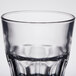 An Arcoroc clear glass with a pattern on it.