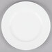 A 10 Strawberry Street Classic White porcelain dinner plate with a white rim on a gray surface.