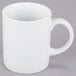 A close-up of a 10 Strawberry Street white porcelain mug with a handle.