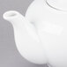 A white 10 Strawberry Street porcelain teapot with a lid and spout.