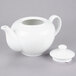 A white 10 Strawberry Street porcelain teapot with a lid.