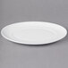 A white 10 Strawberry Street Ricard porcelain salad plate with a rim.