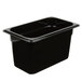 A Cambro black plastic food pan on a counter.