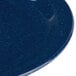 A close up of a shiny blue Carlisle Dallas Ware melamine plate.