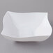 A white Fineline Wavetrends serving bowl with a curved edge.