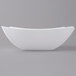 A close up of a white Fineline Wavetrends serving bowl with a curved edge.