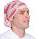 A man wearing a pink and blue Headsweats bandana.