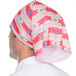 A man wearing a Headsweats Mojave Full Ultra Band headband with a pink and blue pattern.