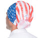A man wearing a Headsweats American flag headband with red, white, and blue stripes.