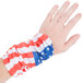 A hand wearing a red, white, and blue American flag fabric headband.
