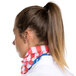 A woman with a ponytail wearing a American flag headband.