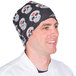 A man wearing a black Headsweats skull ultra band headband.
