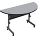 A grey and black Correll half round seminar table with wheels.
