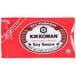 A red Kikkoman soy sauce packet with white and black text.