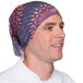 A man wearing a Headsweats headband with a purple design.