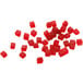 A pile of red cubes diced with a Robot Coupe 3/16" Dicing Kit.