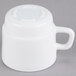 An Arcoroc white stackable mug with a handle.