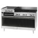 A Blodgett stainless steel commercial range with 6 burners, a raised griddle, and a broiler.
