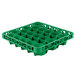 A green plastic Carlisle glass rack extender with circles and holes.
