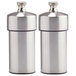 A pair of stainless steel Chef Specialties salt and pepper mills.