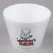 A white Dart foam food container with a pig logo.