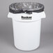 A white Continental round trash can with a black bag inside.
